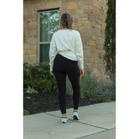 Julia Rose The Lilla black fleece full-length leggings with pockets, Women wearing black fleece-lined leggings with side pockets