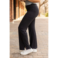 High-waisted relaxed fit leggings in buttery soft fabric. Close-up of waistband and pocket detail on Julia Rose Rachel leggings